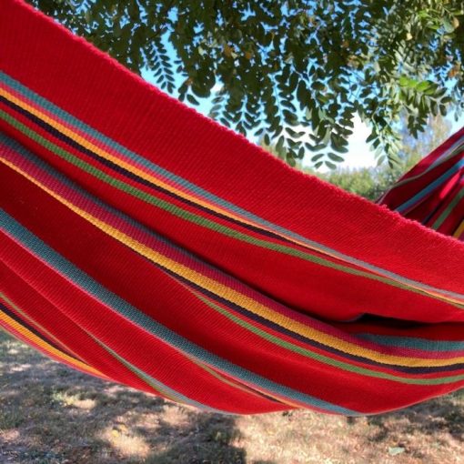 A bright red classic hammock handcrafted in Colombia
